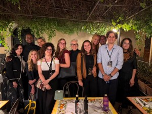 Kylie, standing with a large group of judges at a restauraunt