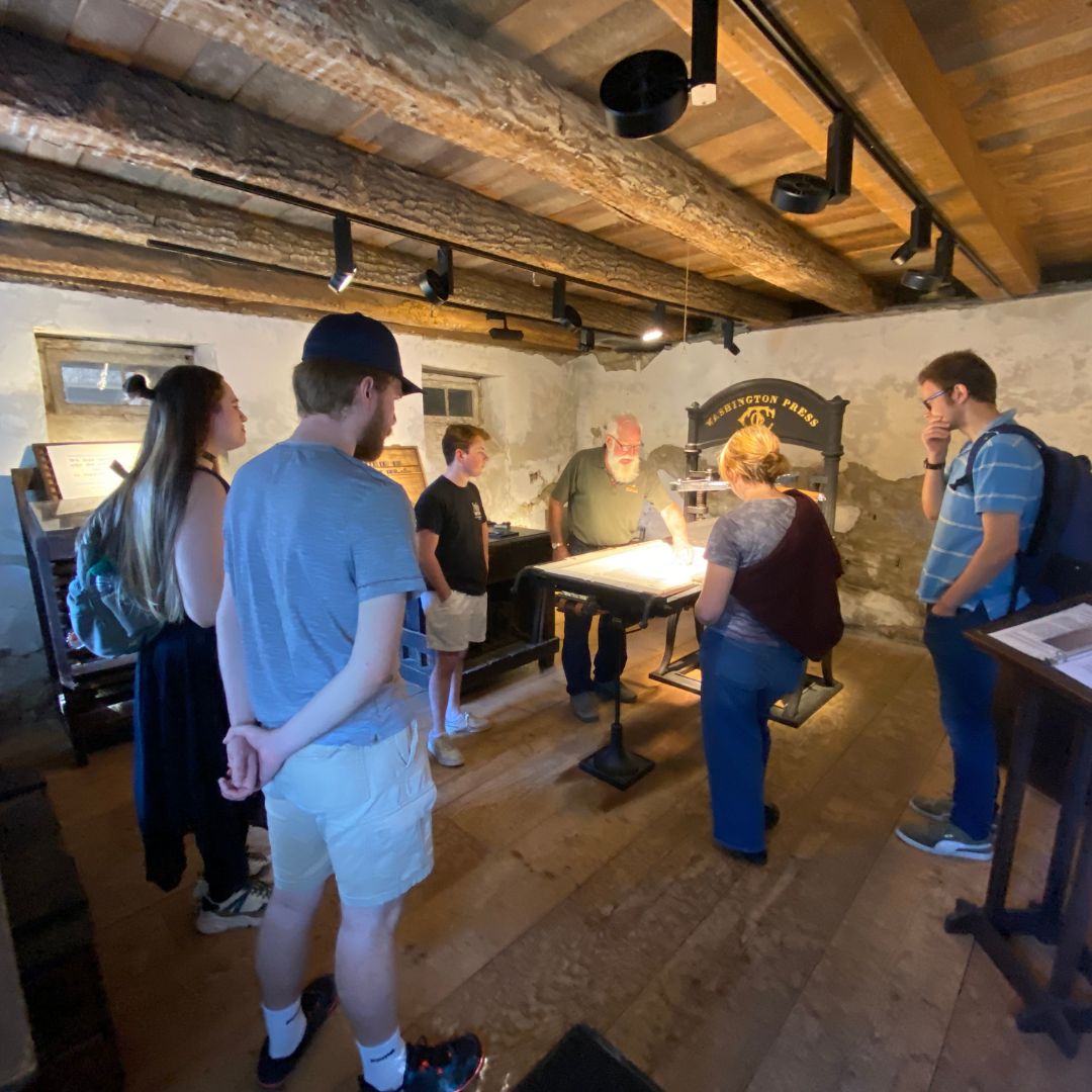 Photo of students looking at wine making