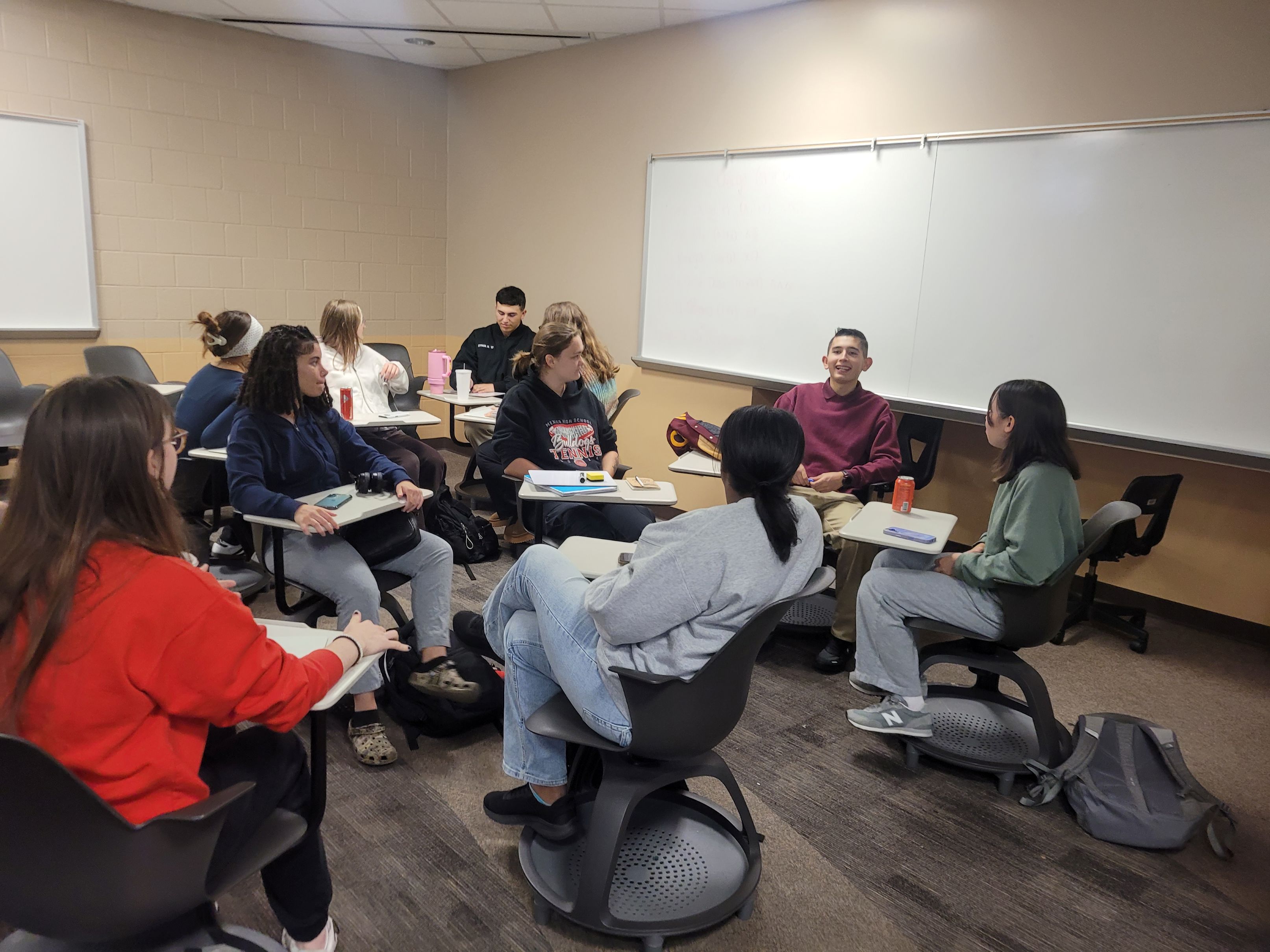 Students sitting and talking to one another