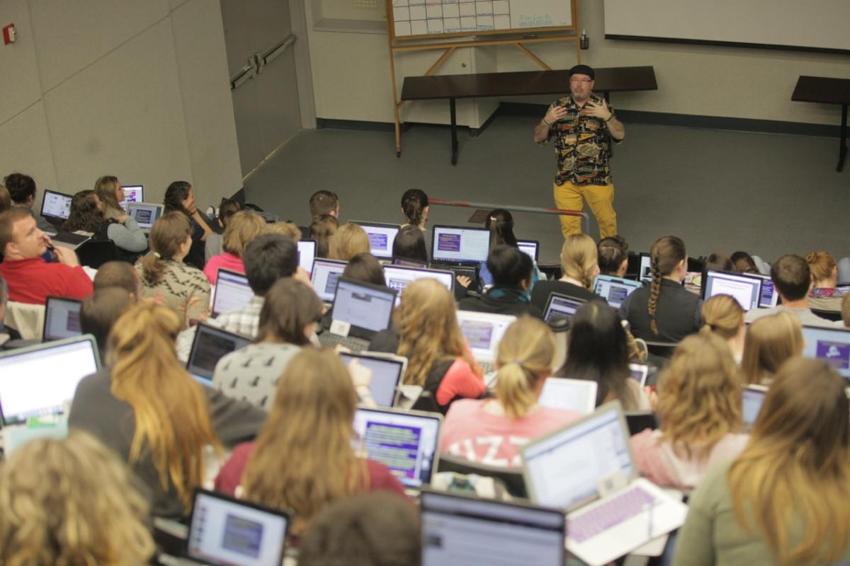 a photo of a professor teaching in a classroom