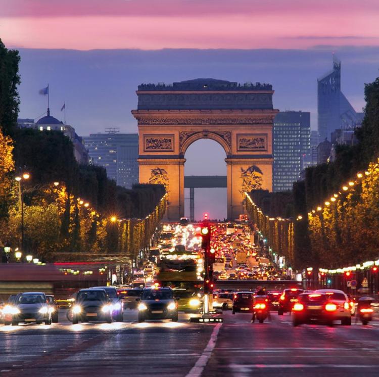 Champs Elysees and Arc de Triomphe in Paris France. night scene with car traffic