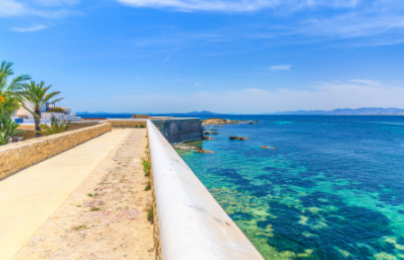 A walkway and ocean in Alicante, Spain
