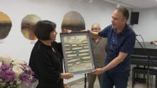 Dr. Cordones-Cook receiving the Dulce María Loynaz International Award from Luis Morlote