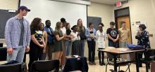 Prof. Cordones-Cook with the authors and performers