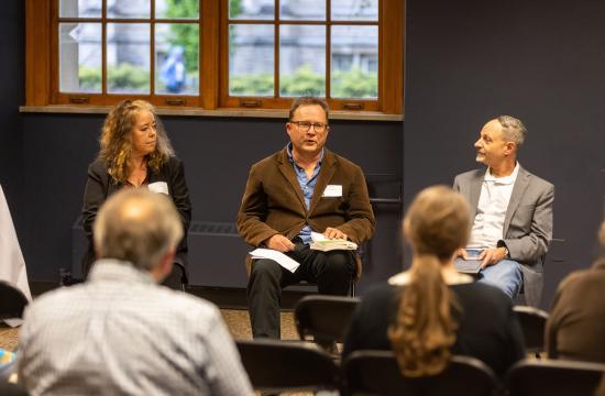 Sean Franzel, center, speaks at the Faculty Book Authors Celebration during Faculty Excellence Week 2024.